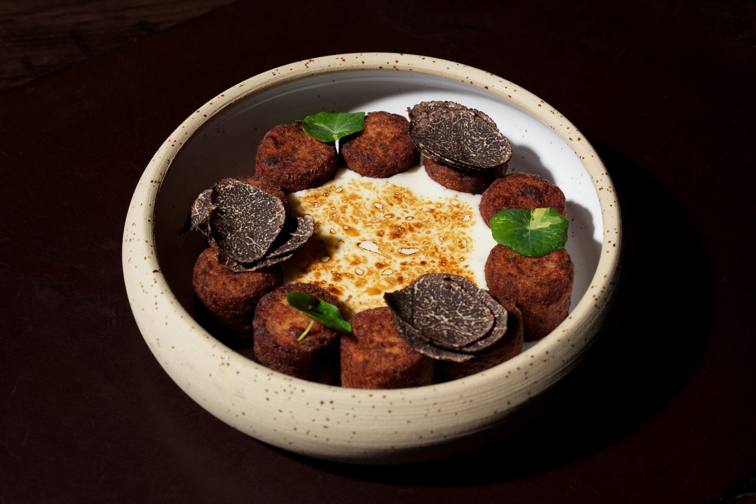 Garrison Tater Tots with Raclette Cheese, Black Truffles