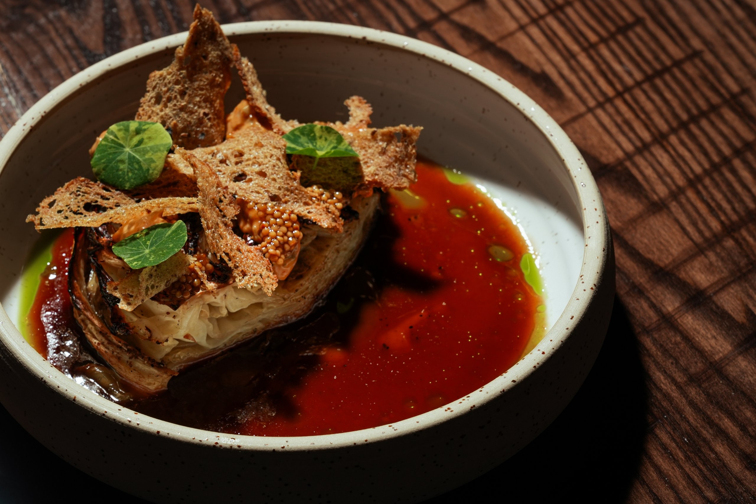 Smoked Cabbage dish includes Pastrami-Spiced Vegetable Jus, Rye, Pickled Mustard Seeds