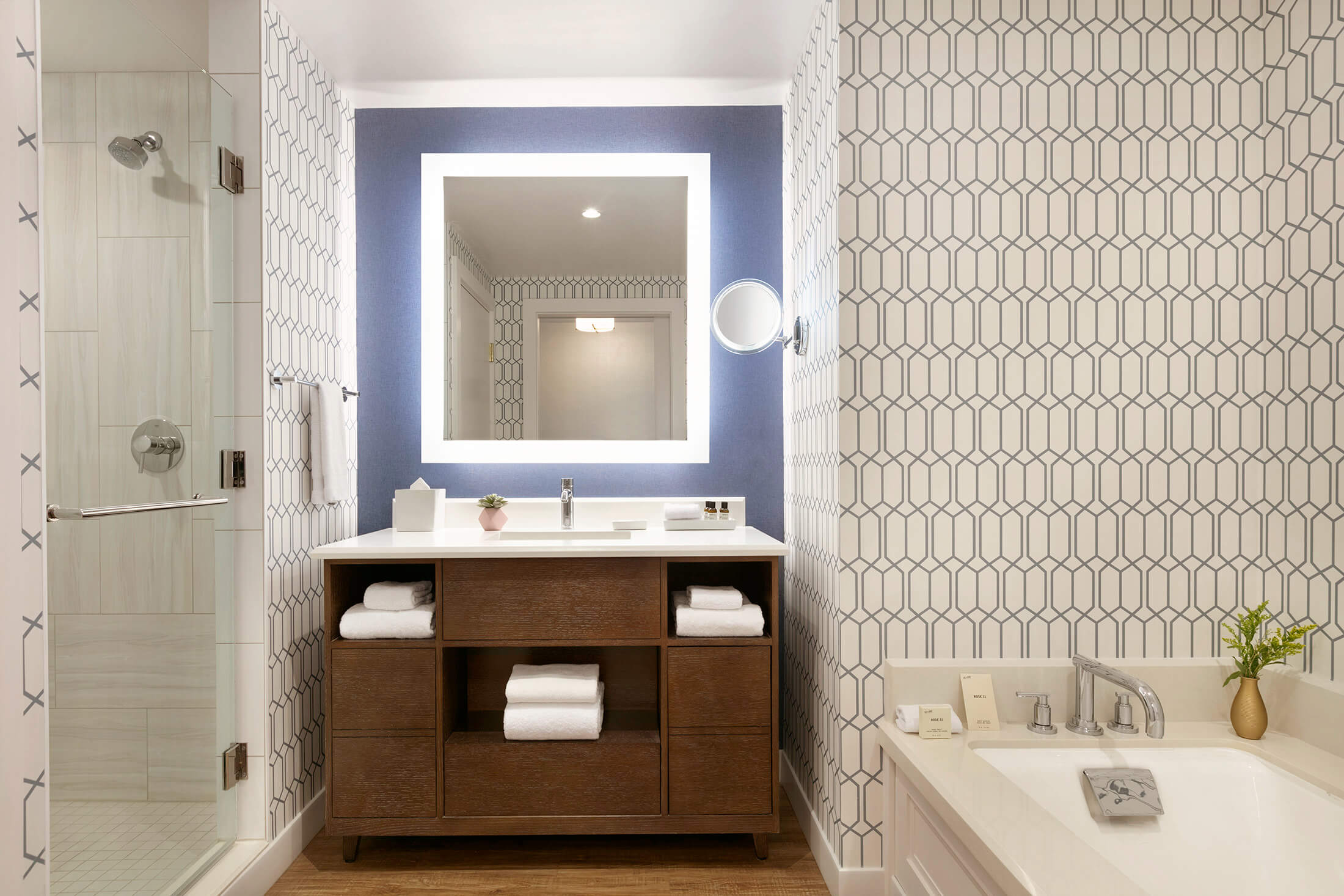 Fairmont Austin Hotel suite bathroom interior with tub and standing shower.