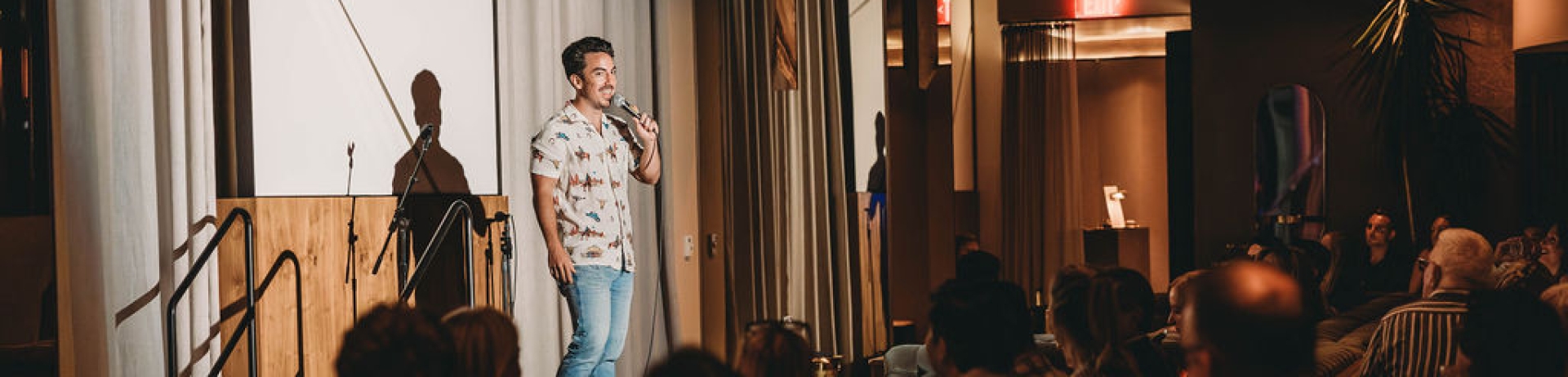 comedian doing stand-up in an intimate venue