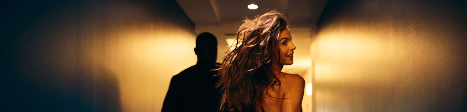 couple running down a hallway