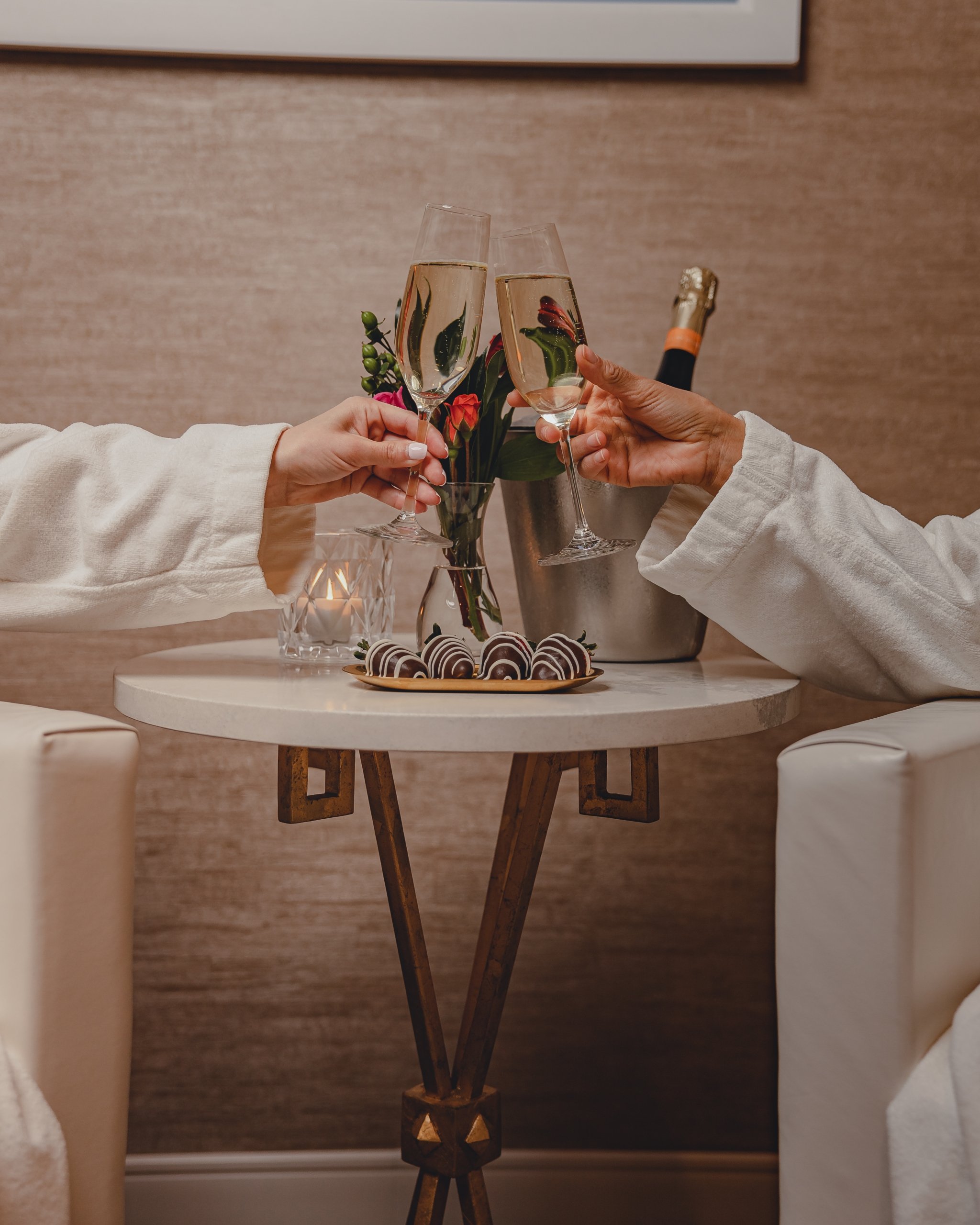 couple enjoying champagne in a spa