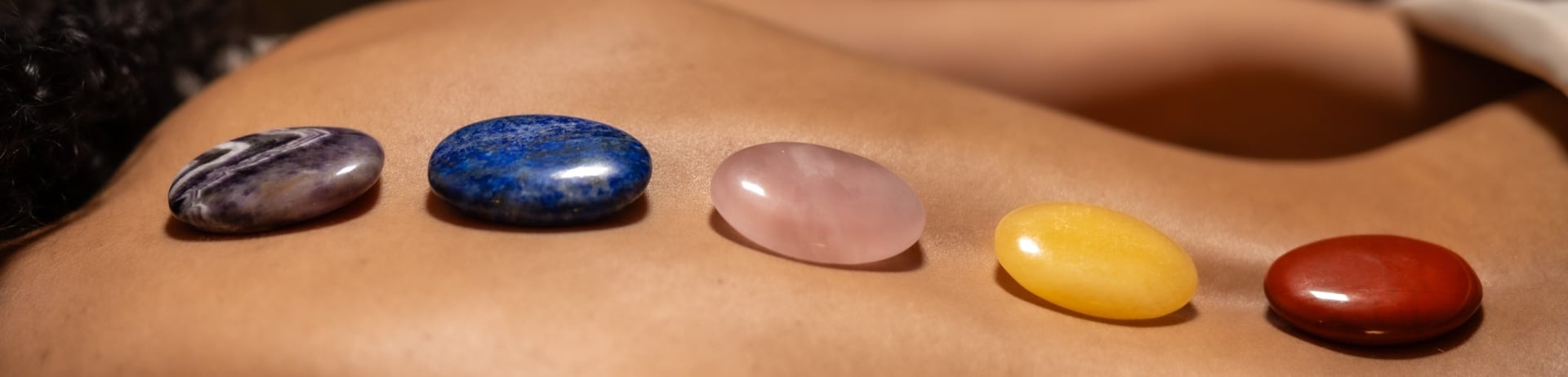 woman with hot stones on her back