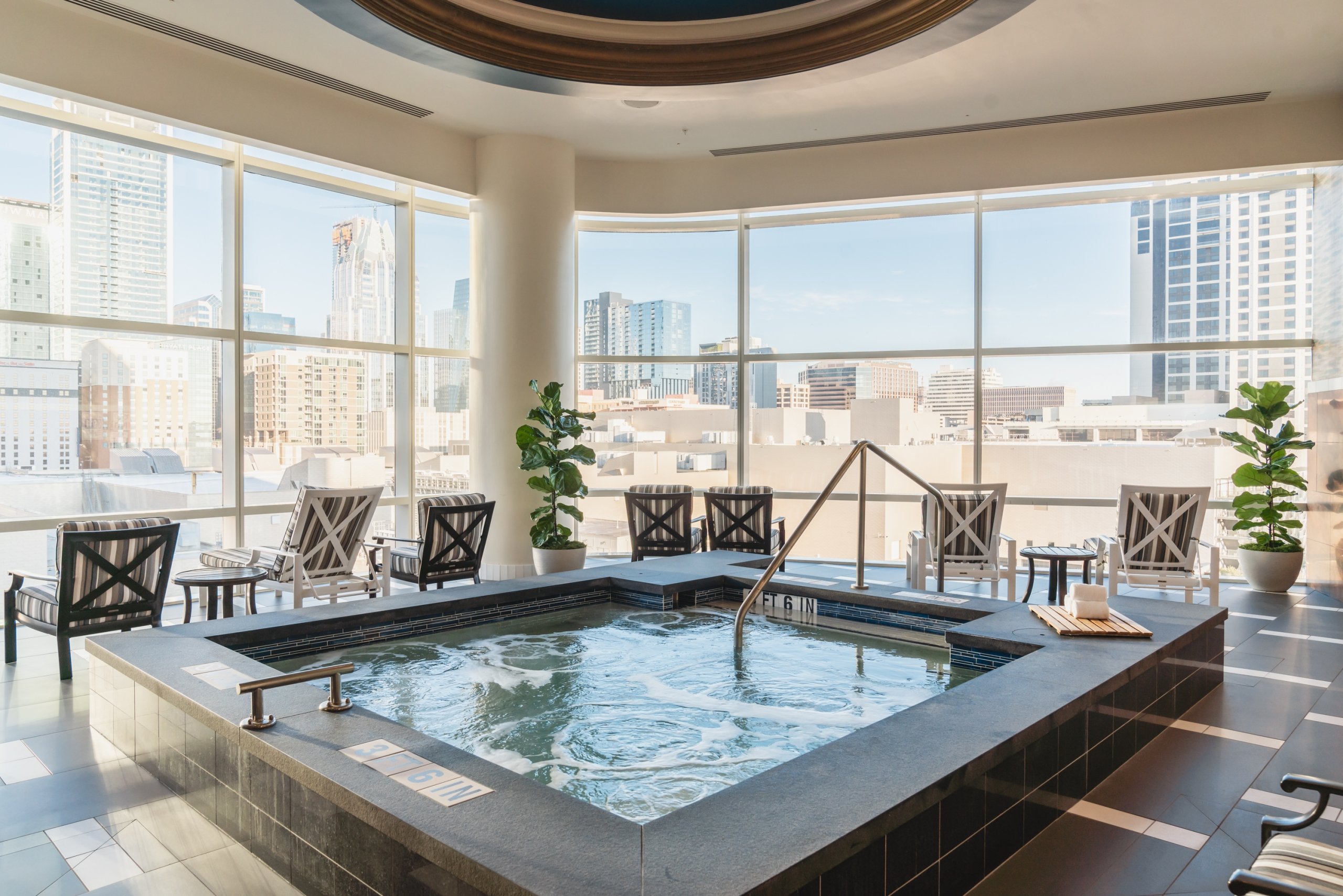 Men's Spa Lounge featuring hot soaking tub, sauna, steam room and cold plunge.